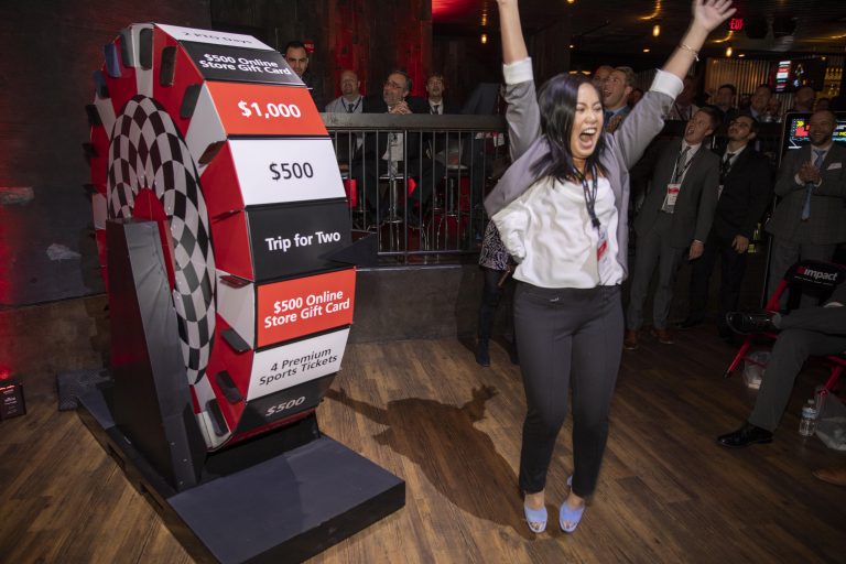 Employee winning trip for two from Impact Networking.